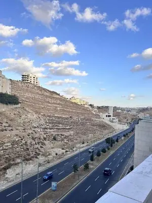a view of a highway with cars on it at Bargos Cave in Amman