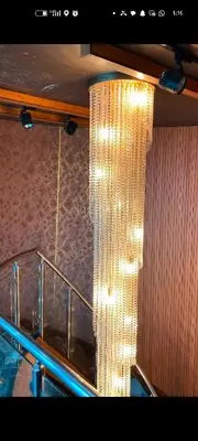 a large chandelier hanging from the ceiling of a restaurant at شقه دوبلكس داماك العبدلي in Amman