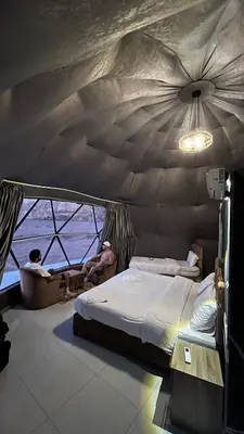 a room with two beds in a tent at RUM HiLTON lUXURY CAMP in Wadi Rum
