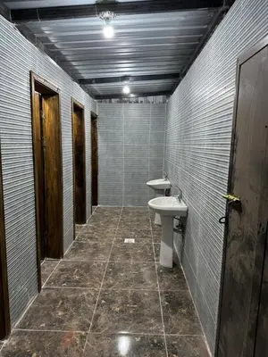 a bathroom with a sink and a toilet at Desert Rock Wadi Rum in Wadi Rum