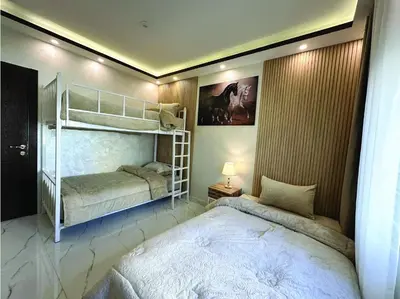 a bedroom with two bunk beds in a room at Alsadi Housing- Jabal Amman in Amman