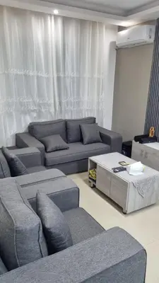 a living room with couches and a couch and a table at Beit Alhana in Amman