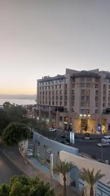 a view of a building in a city with a street at فندق الشلالات العقبه Waterfalls Hotel Aqaba in Aqaba