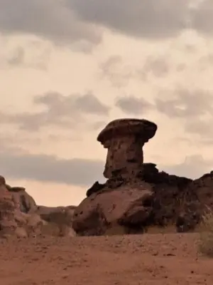 a rock formation in the middle of the desert at واي رم in Wadi Rum