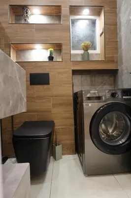 a washer and dryer in a small bathroom at A luxurious apartment for relaxation in Amman in Amman