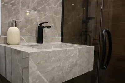a bathroom sink with a soap dispenser on it at A luxurious apartment for relaxation in Amman in Amman