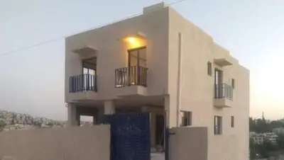 a building with a light on top of it at citadel mountain sun guest house in Amman
