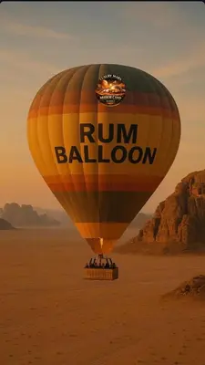 a hot air balloon flying over the desert at MARS MIRROR BUBBLE lUXURY CAMP in Wadi Rum