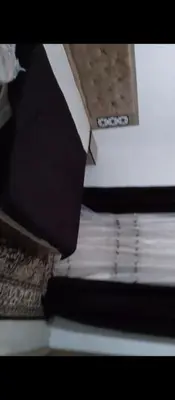a stack of books sitting on top of a table at Ara Home in Amman