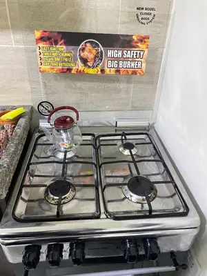 a stove top with a container on top of it at Osama Alnaser in Amman