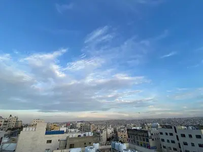 a view of a city under a cloudy sky at Osama Alnaser in Amman