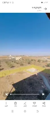 an aerial view of a field with a blue sky at اربد طريق البترول دبج مول فيلا مزرعة مفروشة للايجار يومي أسبوعي شهري in Juḩfīyah