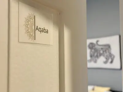 a door with a sign that says apedia on it at Beit Ahlan in Amman