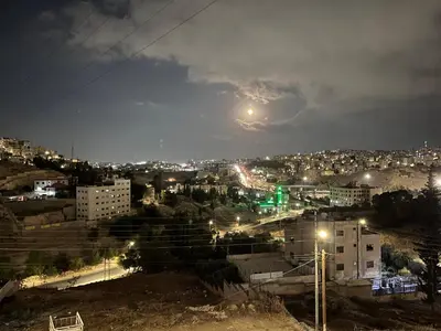 a view of a city at night at \u9f99\u95e8\u5ba2\u6808 in Amman