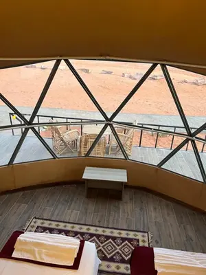 a view from the top of a building with a window at HOlIDAY LUXURY WADI RUM in Wadi Rum