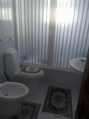 a bathroom with a toilet and a sink at جبيهه in Amman