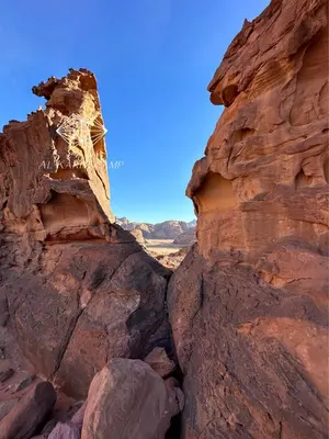 a view of the desert from a rock formation at Alkaram luxury camp in Wadi Rum
