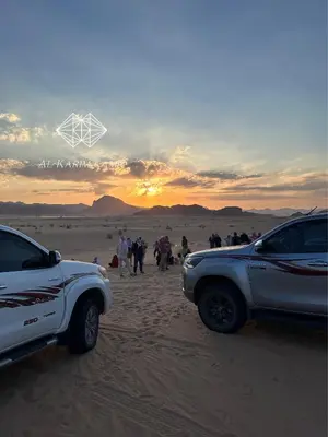a group of people walking in the desert at Alkaram luxury camp in Wadi Rum