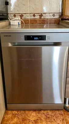 a stainless steel dishwasher in a kitchen at Aqaba Drought inn in Aqaba