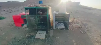 a group of appliances sitting in a dirt field at Wadi Ghowair View Camp in Al Khuraybah