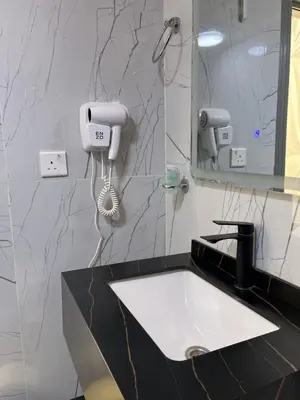 a bathroom with a sink and a mirror at The Flowers Camp in Wadi Rum