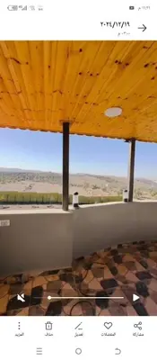 a view of the desert from a room with a wooden ceiling at فيلا اربد طريق البترول in Juḩfīyah