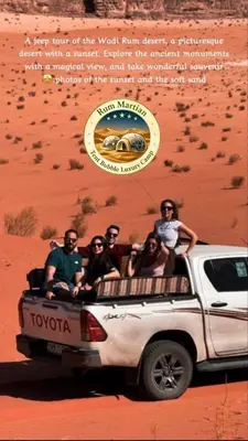 a group of people riding in the back of a truck at RUM MARTIAN TENT BUBBLES lUXURY CAMP in Wadi Rum
