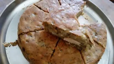 a white plate with a piece of food on it at Board apartment in Irbid