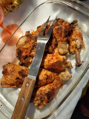 a plate of food with a pair of scissors at Coazmatic apartment in Kerak
