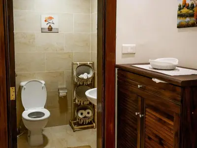 a bathroom with a toilet and a sink at Yafa 2BR N Abdoun Apartment in Amman