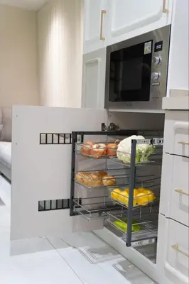 a kitchen with a shelf with bread and a microwave at Halimah 3BR Luxury Apt-Der Ghbar in Amman