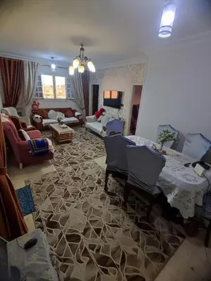 a large living room with a table and chairs at Zarmot INN in Az Zarqa
