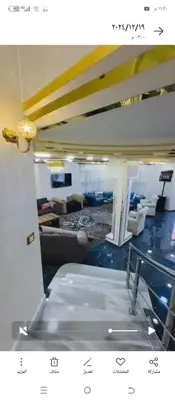 a view of a living room with a couch and chairs at Mona villa in Irbid
