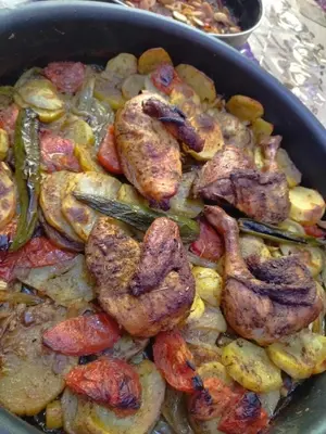 a pan of food with shrimp and vegetables in it at Poster apartment in Maḩaţţat Jurf ad Darāwīsh