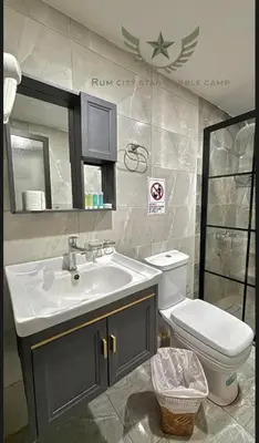 a bathroom with a sink and a toilet at RUM CITY STAR BUBBLE lUXURY CAMP in Wadi Rum