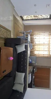 a room with a bed with pillows and a window at zragat hotel in Jerash