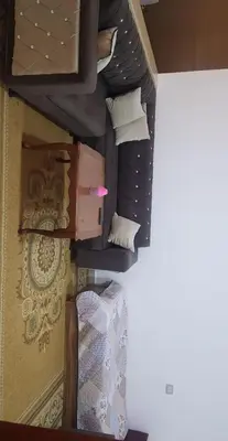 an overhead view of a bedroom with a bed and pillows at zragat hotel in Jerash