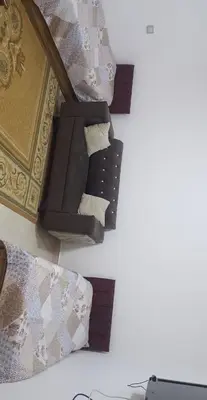 two beds with pillows and a bed frame at zragat hotel in Jerash