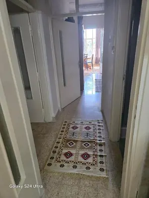 a hallway with a rug on the floor at Lukanda Apartment Feel at Home in Amman