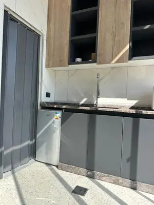 a kitchen with a sink and a counter at the royal occasion amman in Amman