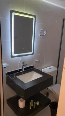 a bathroom with a sink and a mirror at Amin Camp in Wadi Rum