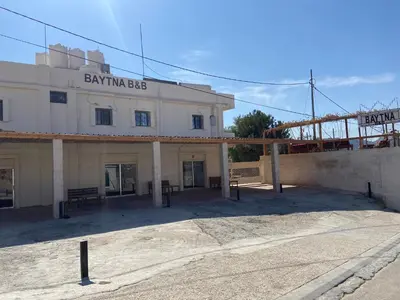 a building that is under construction on a street at Baytna Hotel in Petra
