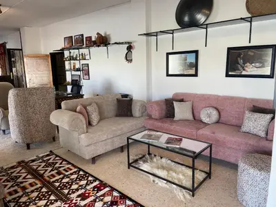 a living room with a couch and a table at Baytna Hotel in Petra