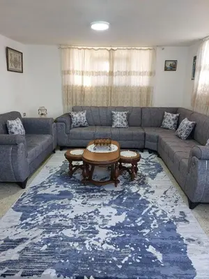 a living room with a couch and a coffee table at Casa la Serena in Madaba