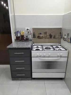 a kitchen with a stove and a counter at New zarqa20 km from Amman in Az Zarqa