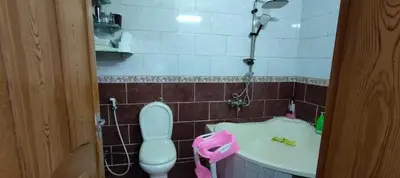 a bathroom with a toilet and a sink at sliver apartment in Bayt Raʼs