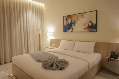 a bedroom with a bed with areath on it at ISHQ Hotel in Aqaba
