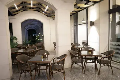 a row of tables and chairs in a restaurant at ISHQ Hotel in Aqaba