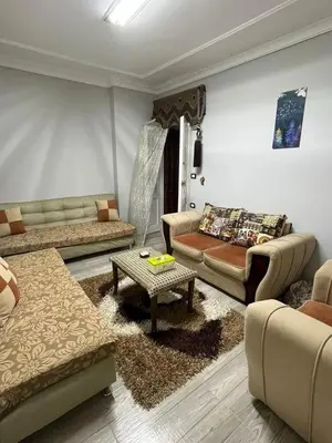 a living room with couches and a coffee table at too house in Al Mughayyir