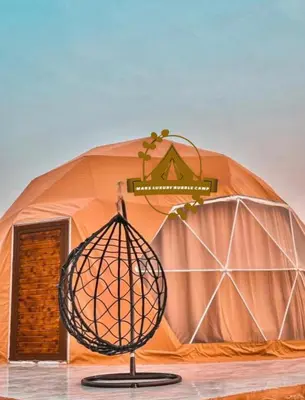 a dome tent with a sign in front of it at RUM MARS BUBBLE lUXURY CAMP in Wadi Rum